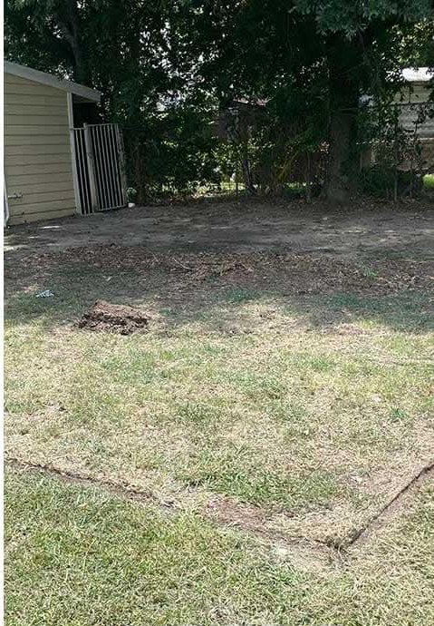 After: swing set removed and the yard cleared